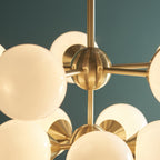 76500 Oscar 11 Light Pendant Brass White