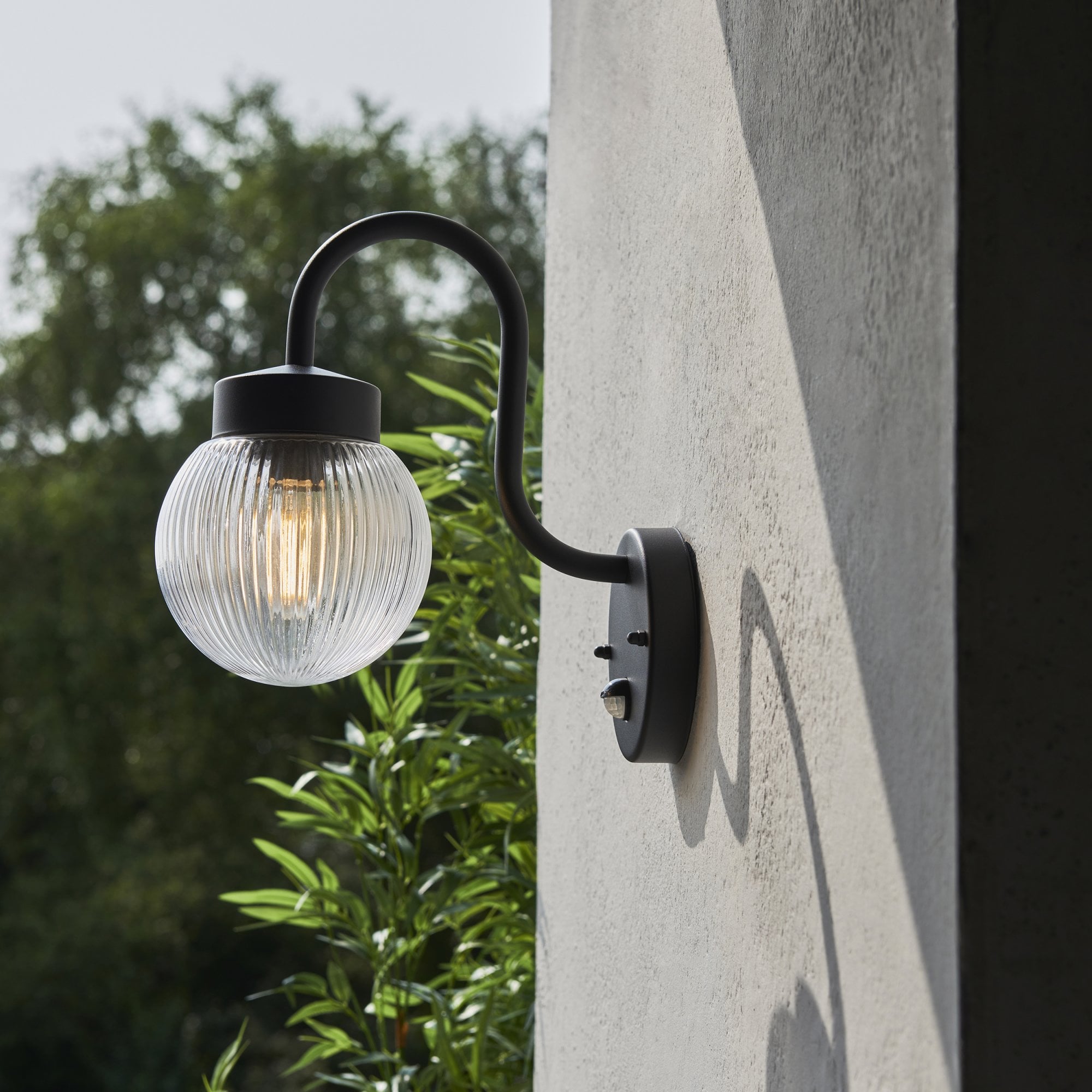 103829 Eldon Outdoor 1 Light Wall Textured Black And Clear Ribbed Glass