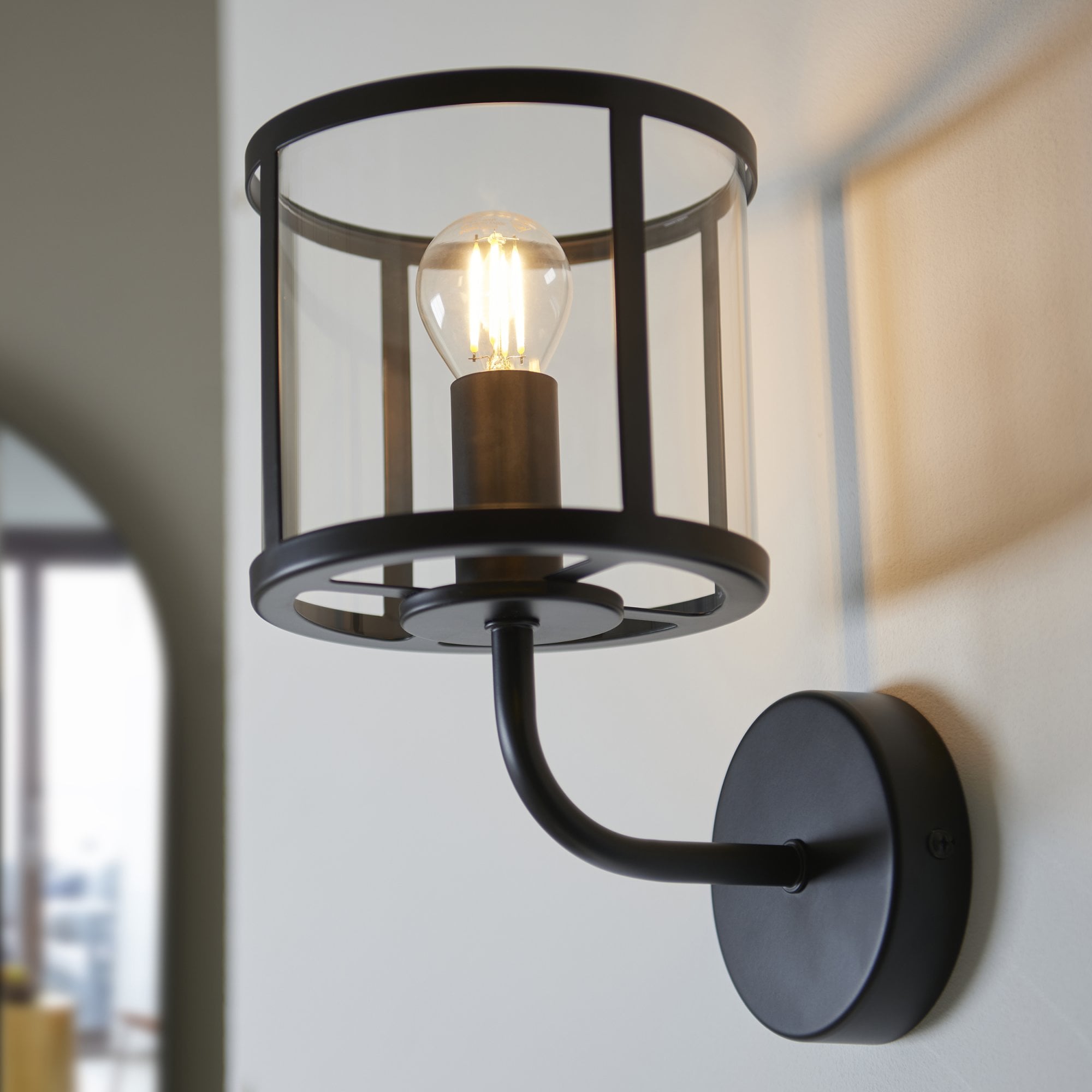 104193 Hopton 1 Light Wall Matt Black And Clear Glass