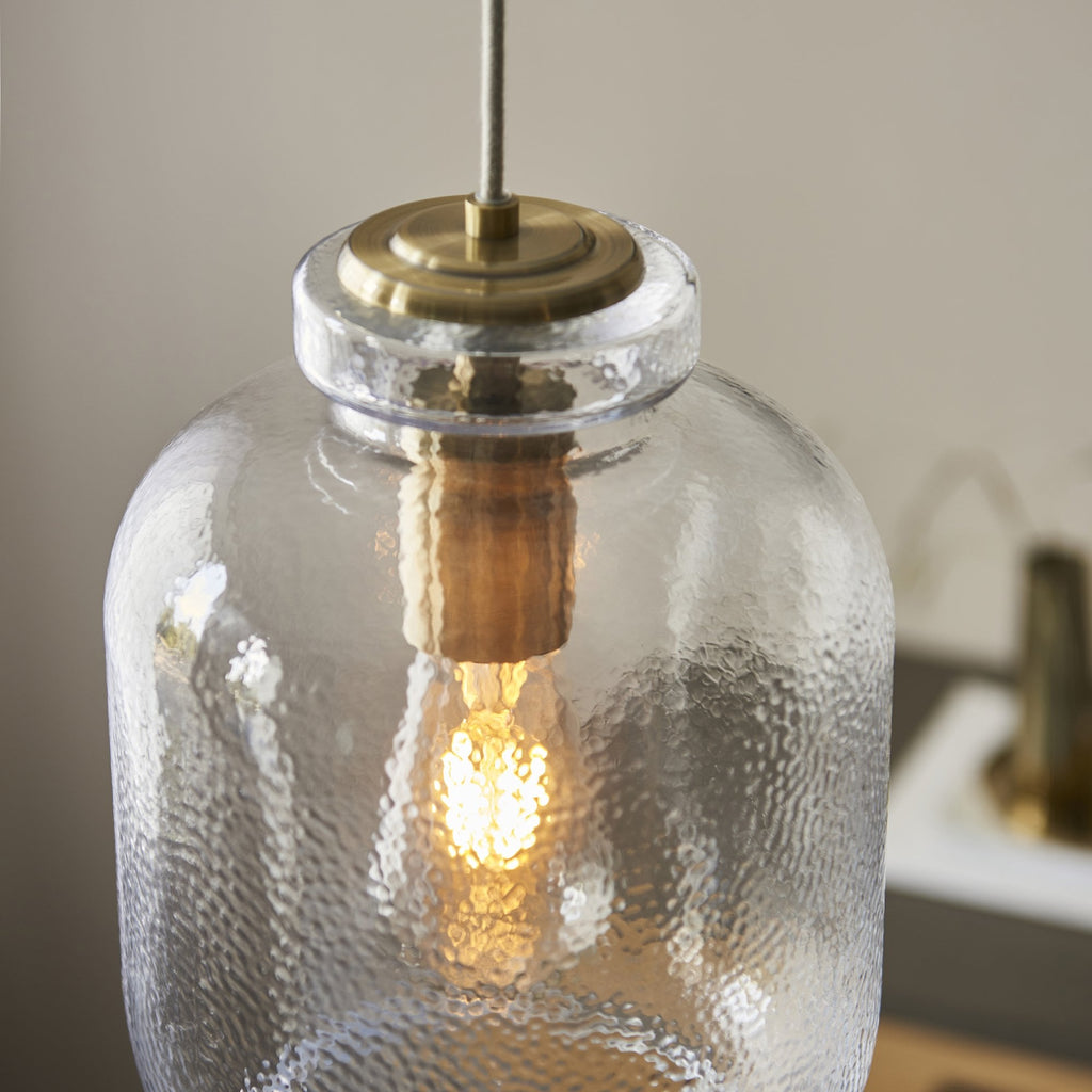 106923 Lyra 1 Light Pendant Clear Textured Glass And Antique Brass Plate