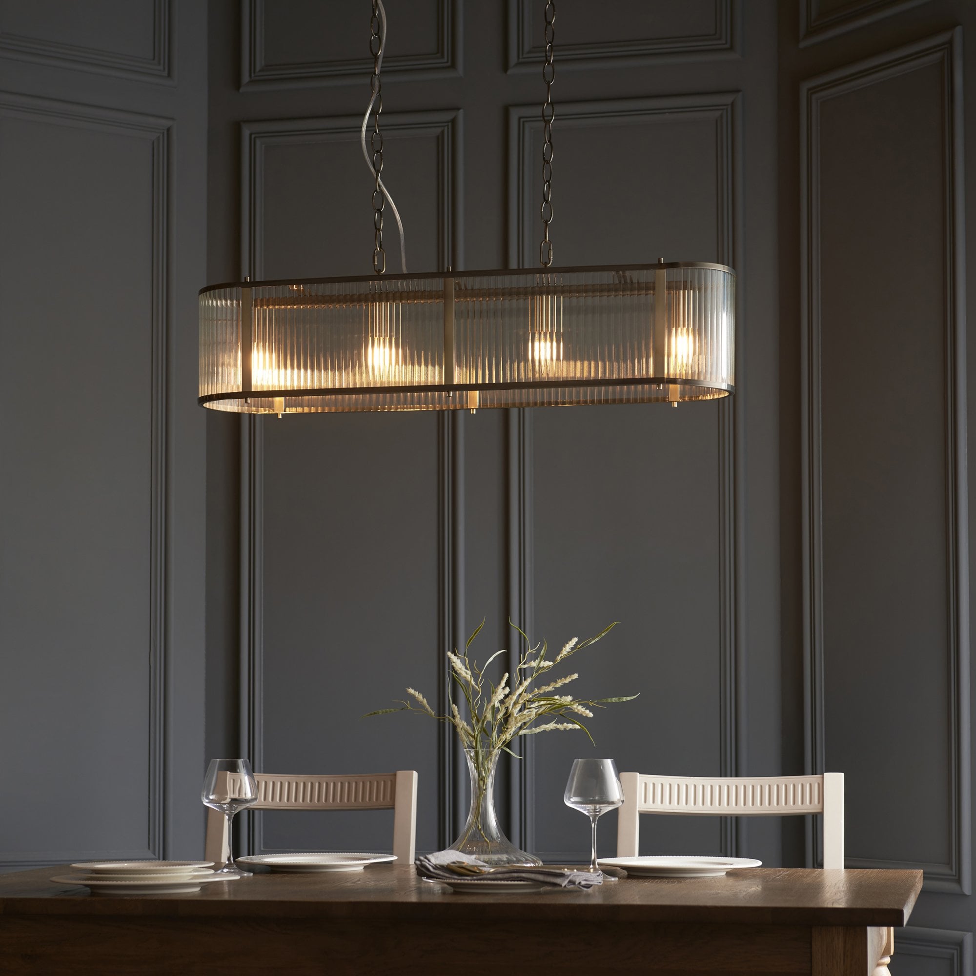 110945 Ridgeton 4 LightLinear Pendant Antique Brass & Clear Glass