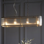 110945 Ridgeton 4 LightLinear Pendant Antique Brass & Clear Glass