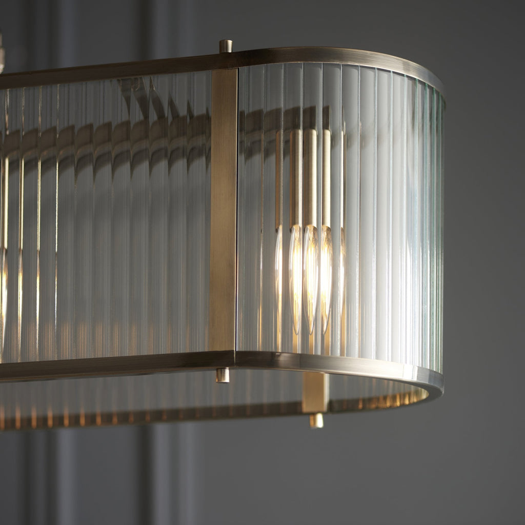 110945 Ridgeton 4 LightLinear Pendant Antique Brass & Clear Glass