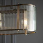 110945 Ridgeton 4 LightLinear Pendant Antique Brass & Clear Glass