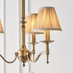 63628 Stanford Antique Brass 3 Light Pendant Beige Shades