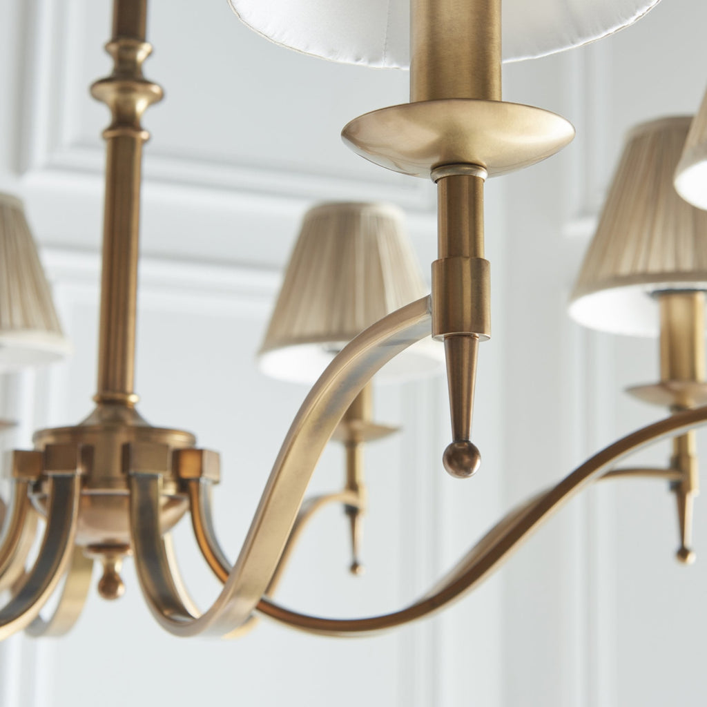 63629 Stanford Antique Brass 8 Light Pendant Beige Shades