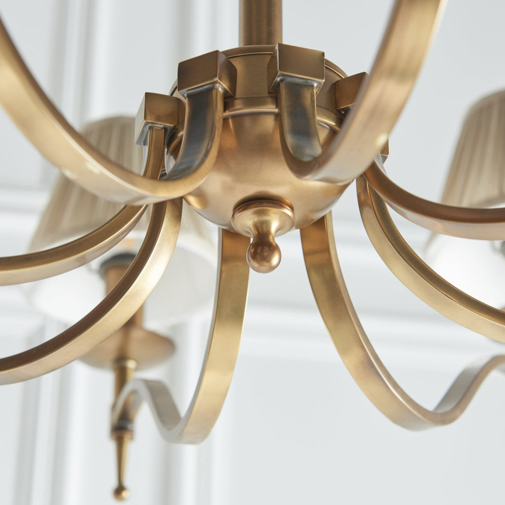 63629 Stanford Antique Brass 8 Light Pendant Beige Shades