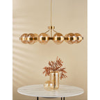 OPH1235 Ophira 12 Light Pendant Antique Gold and Amber Ribbed Glass