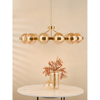 OPH1235 Ophira 12 Light Pendant Antique Gold and Amber Ribbed Glass