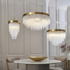 115347 Anistoria Grand 9 Light Pendant Brushed Aged Brass Plate & Clear Glass