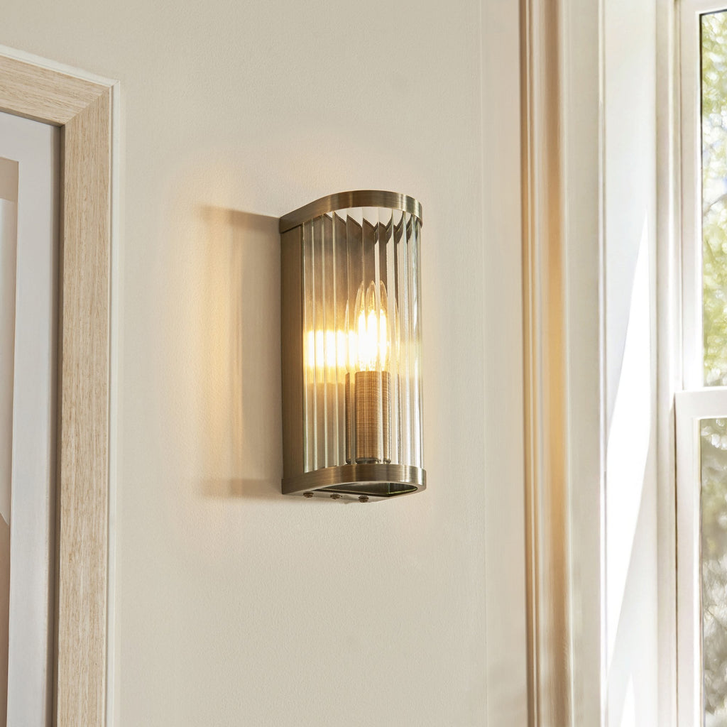 118596 Ridgeton Wall Light Antique Brass Plate & Clear Ribbed Glass