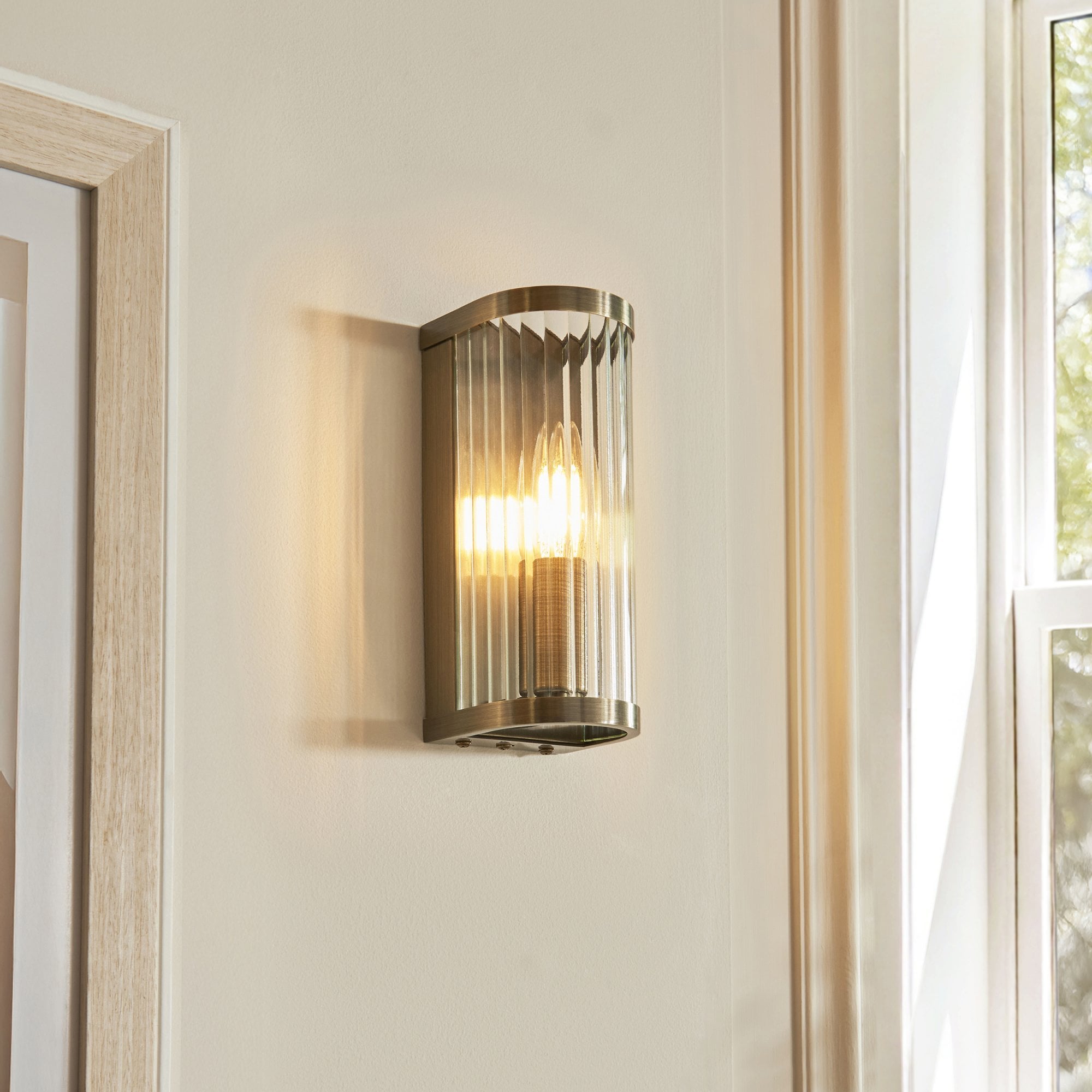 118596 Ridgeton Wall Light Antique Brass Plate & Clear Ribbed Glass