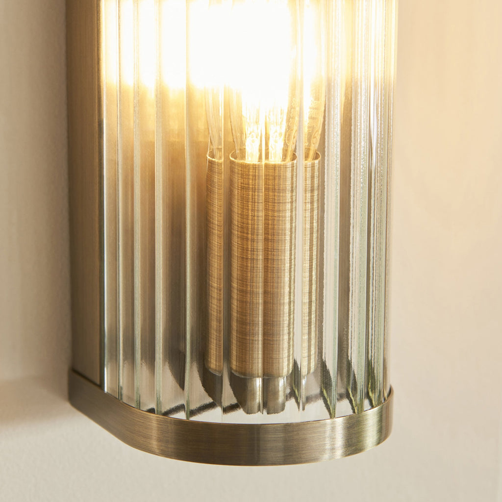 118596 Ridgeton Wall Light Antique Brass Plate & Clear Ribbed Glass