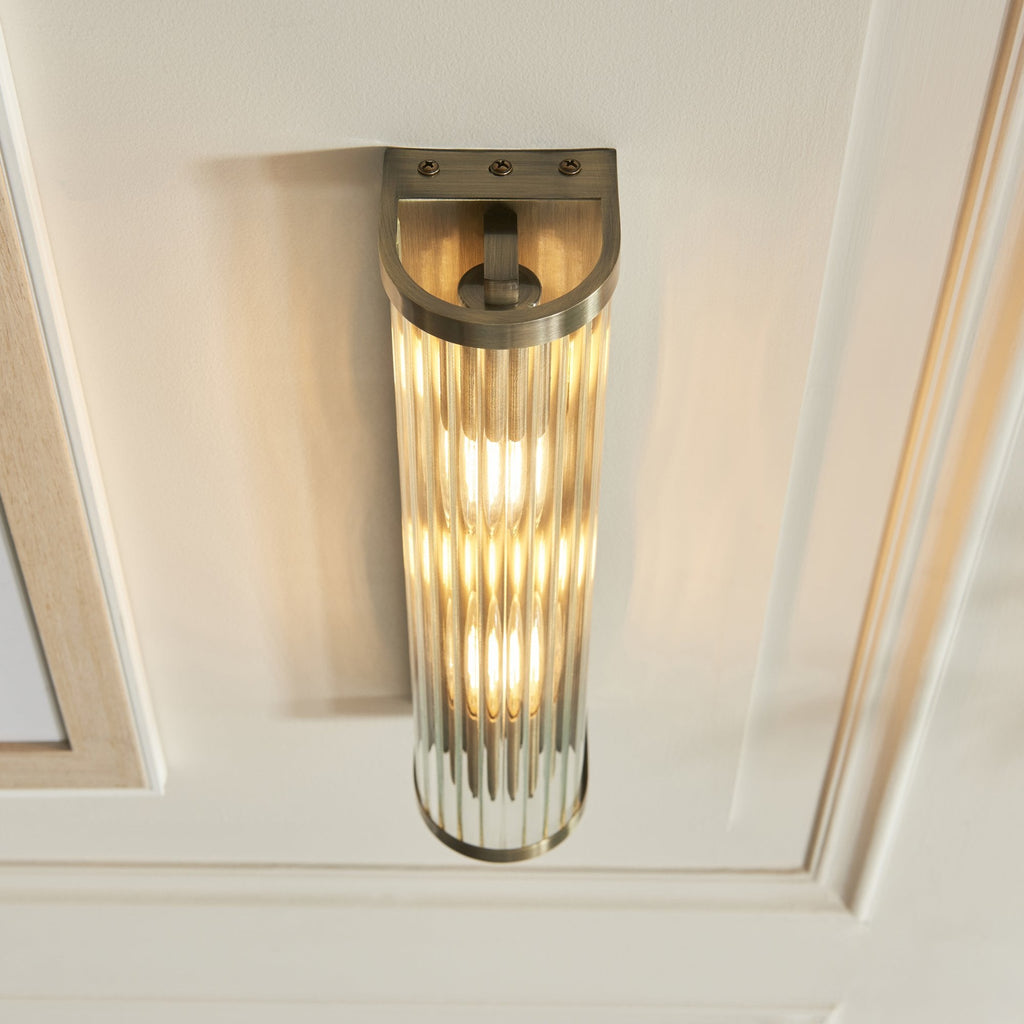 118597 Ridgeton 2 Light Wall Light Antique Brass Plate & Clear Ribbed Glass