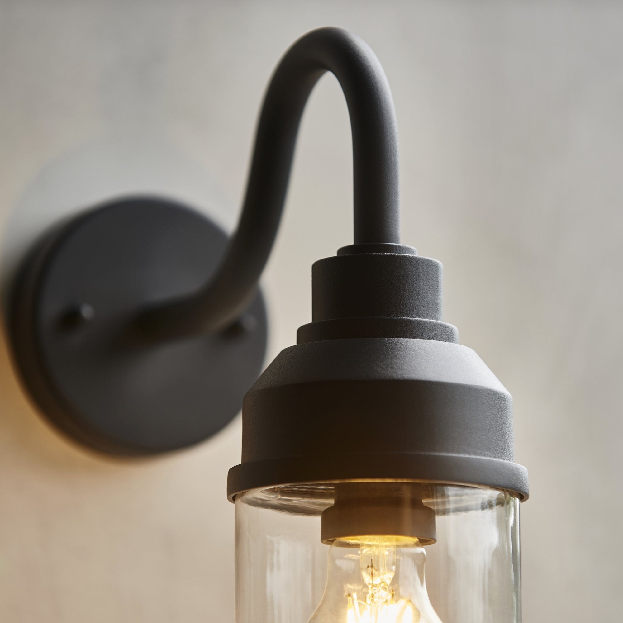 118760 Truro Outdoor Wall Light Textured Black & Clear Glass