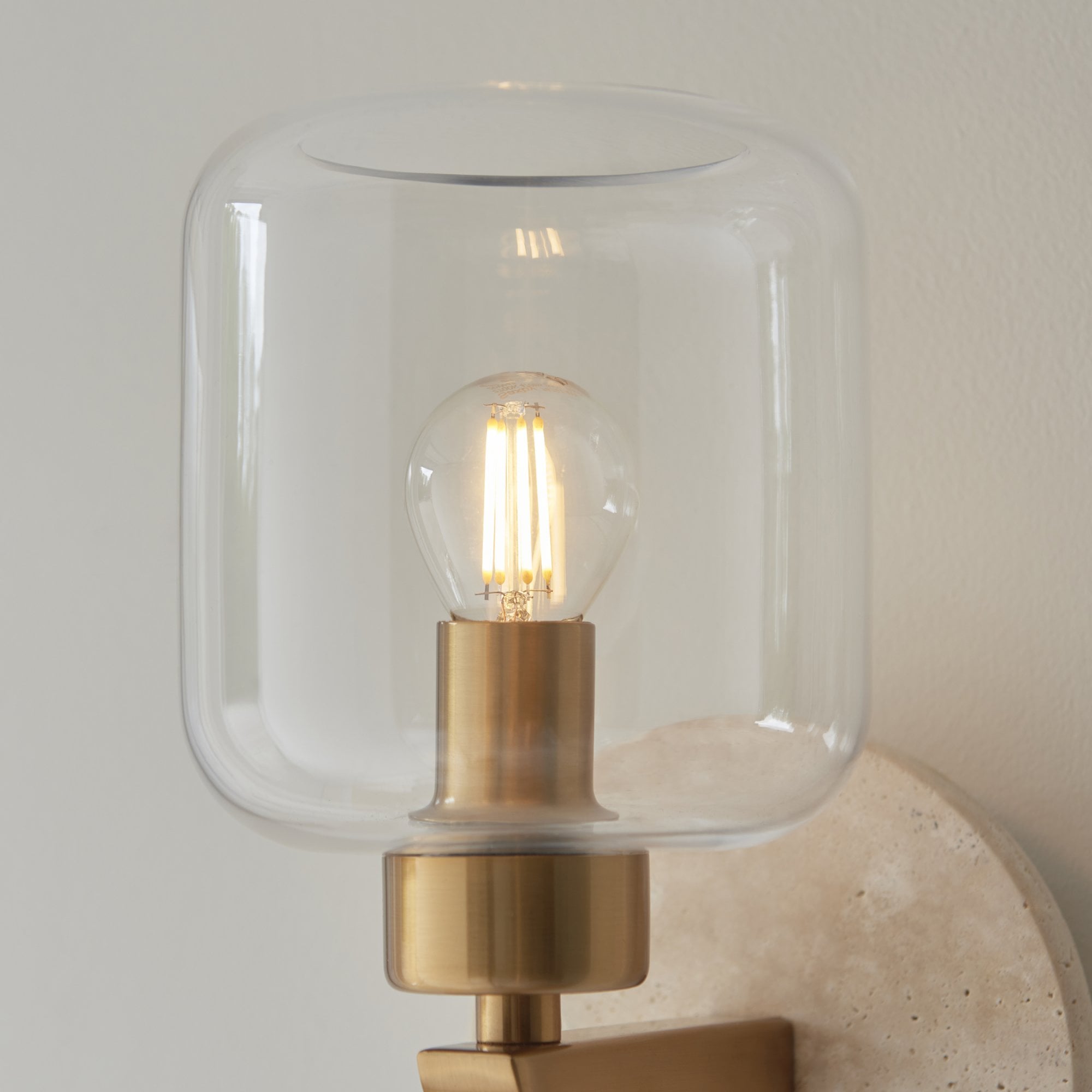 120662 Travi Wall Light Natural Travertine, Vintage Brass & Clear Glass