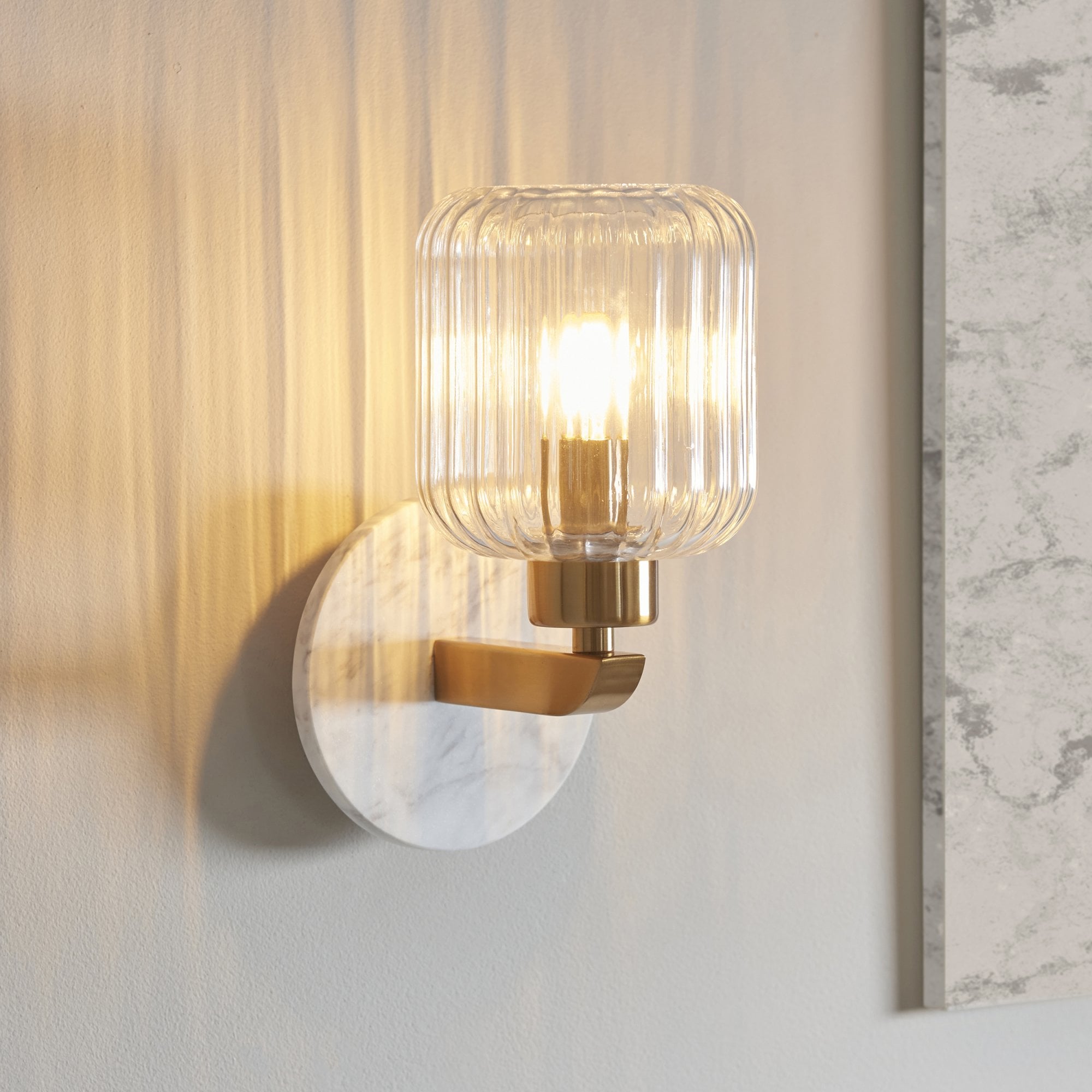 120666 Travi Ribbed Wall Light White Volakas Marble, Vintage Brass & Clear Ribbed Glass