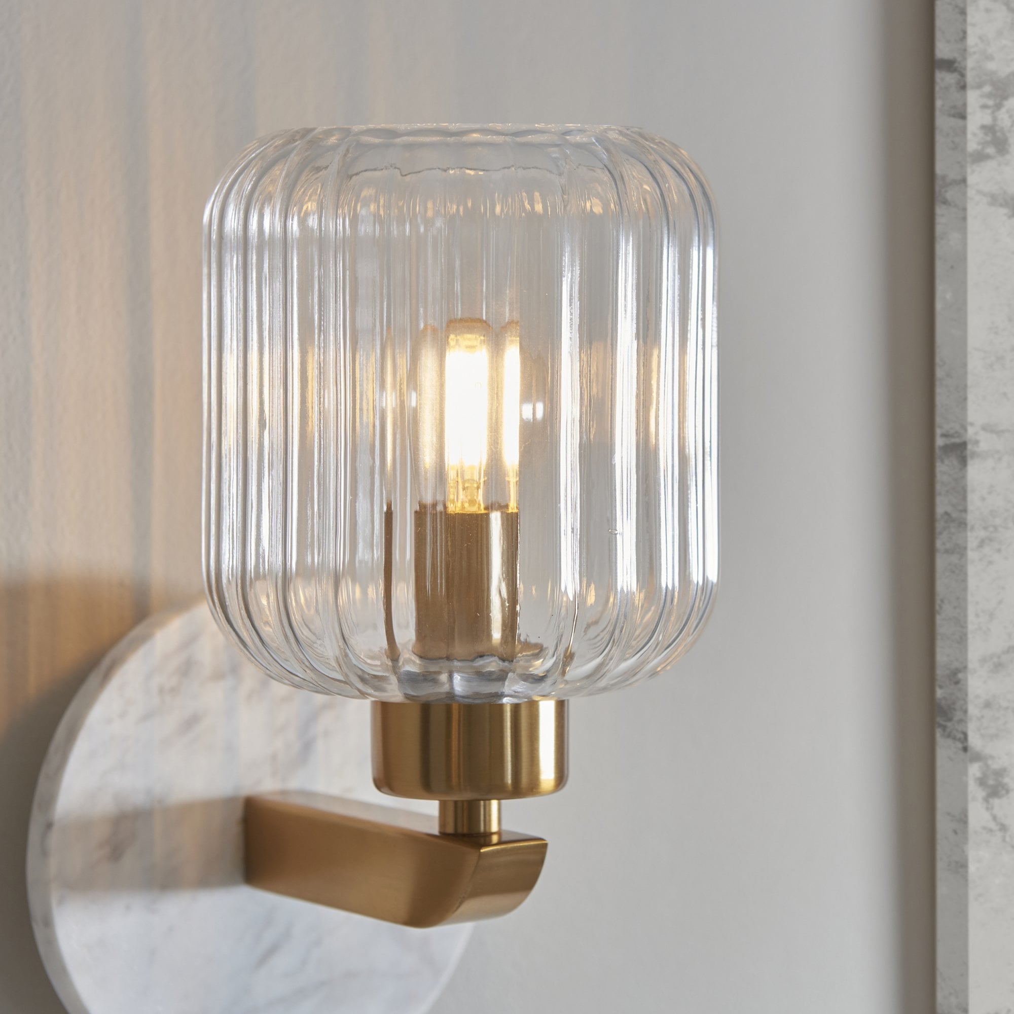 120666 Travi Ribbed Wall Light White Volakas Marble, Vintage Brass & Clear Ribbed Glass