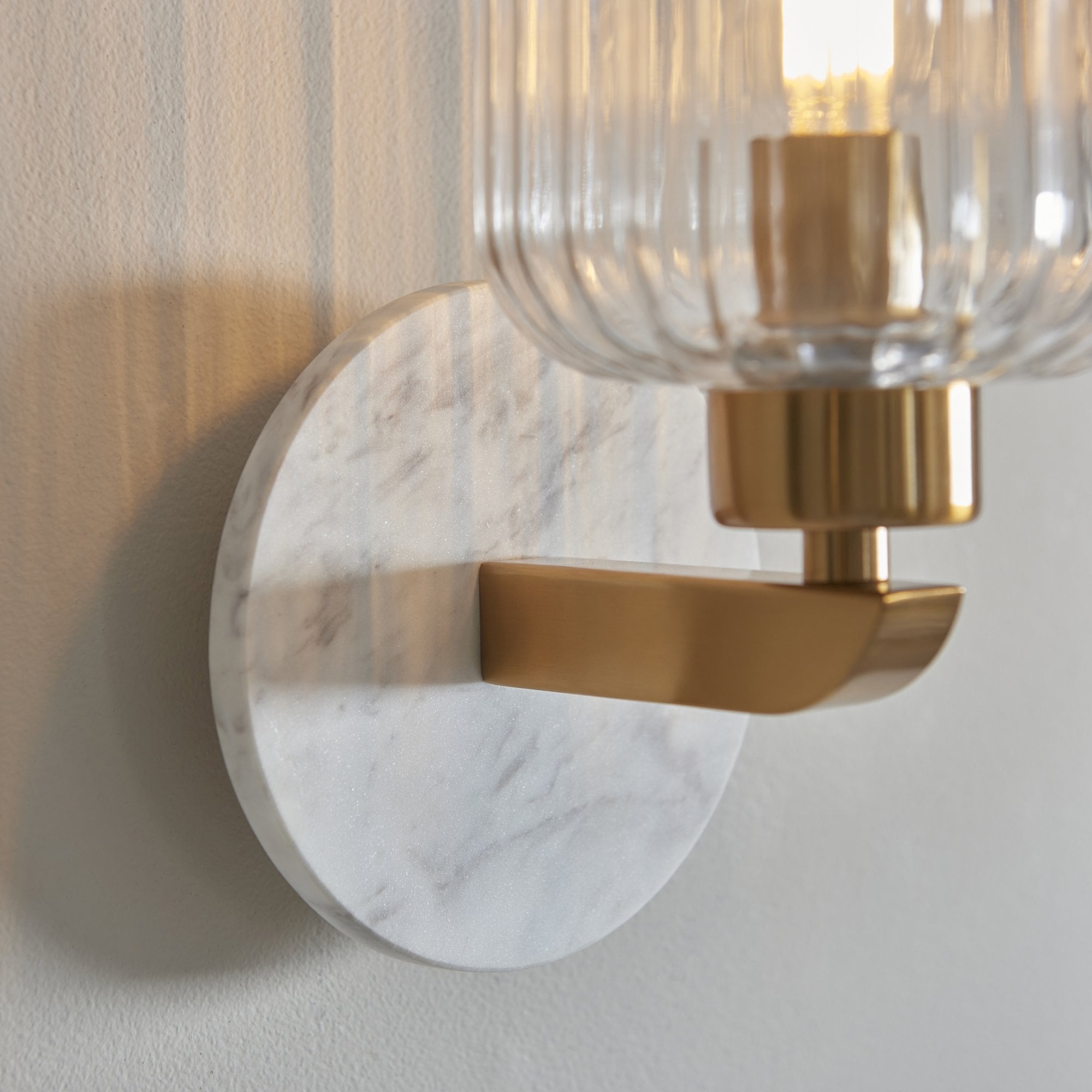 120666 Travi Ribbed Wall Light White Volakas Marble, Vintage Brass & Clear Ribbed Glass