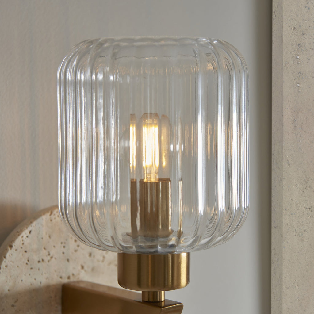 120668 Travi Ribbed Wall Light Beige Textured Marble, Vintage Brass & Clear Ribbed Glass