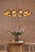 OPH1235 Ophira 12 Light Pendant Antique Gold and Amber Ribbed Glass