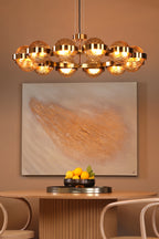 OPH1235 Ophira 12 Light Pendant Antique Gold and Amber Ribbed Glass
