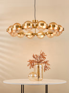 OPH1235 Ophira 12 Light Pendant Antique Gold and Amber Ribbed Glass