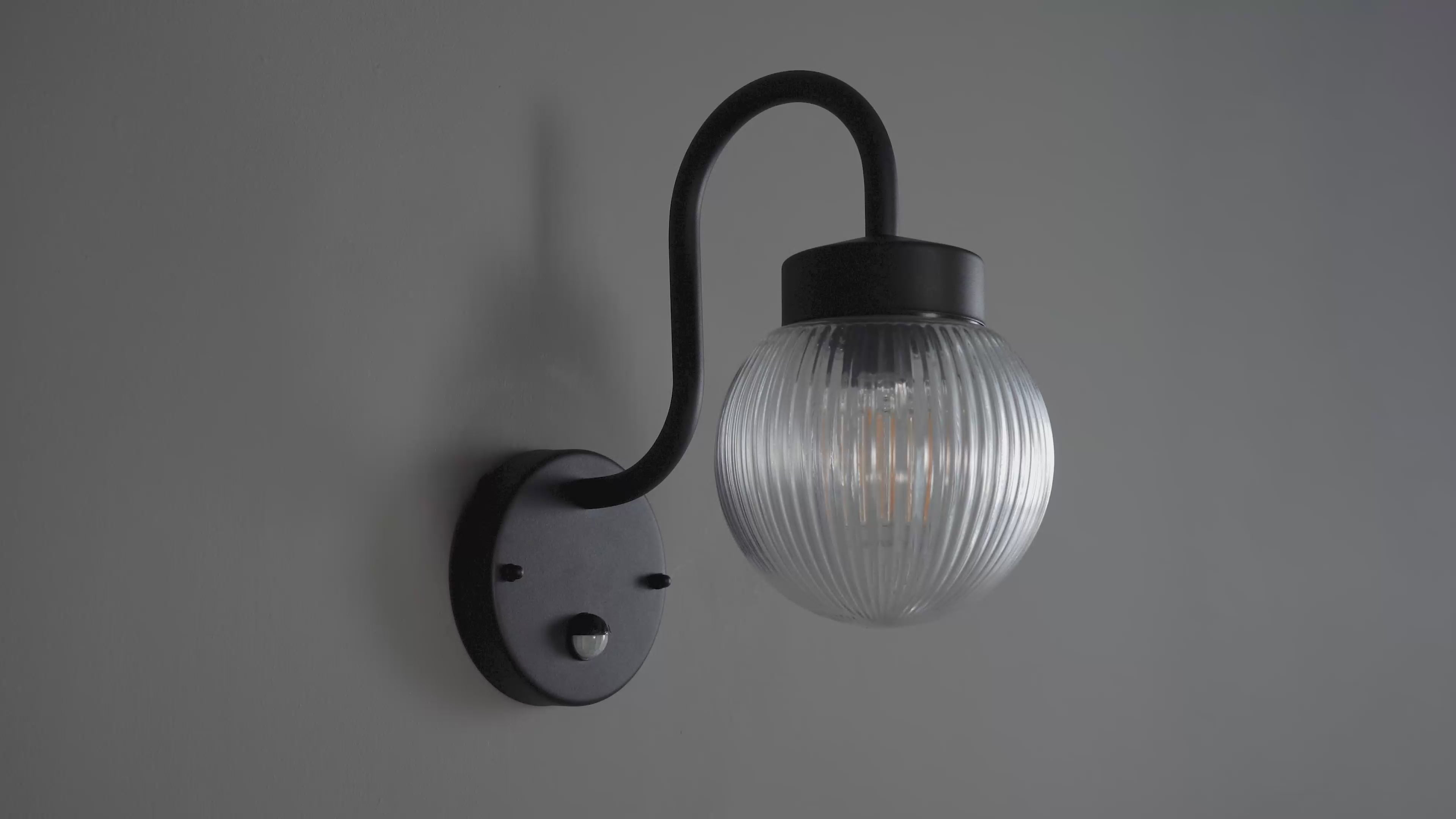 103829 Eldon Outdoor 1 Light Wall Textured Black And Clear Ribbed Glass